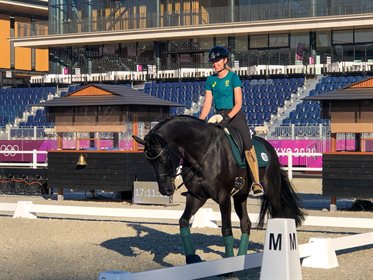 A beaming Simone Pearce walks Destano around the Main Arena in Tokyo. © Equestrian Australia