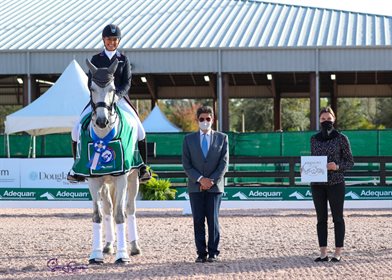 Adrienne Lyle and Harmony’s Duval in their awards presentation with Judge at C Cesar Torrente and Caitlin Lane of AGDF. ©SusanStickle.com