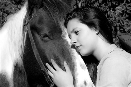 Horse and woman. Labelled for reuse.