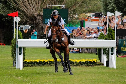 Ingrid Klimke and SAP Hale Bob OLD motor away from the Rolex water complex.