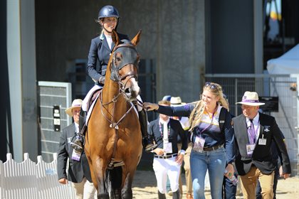 Katie Laurie on Django II leave the arena after their round. © Michelle Terlato Photography