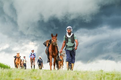 Riders walking horses, with Omer Hayat Khan in foreground. Image: Shari Thompson