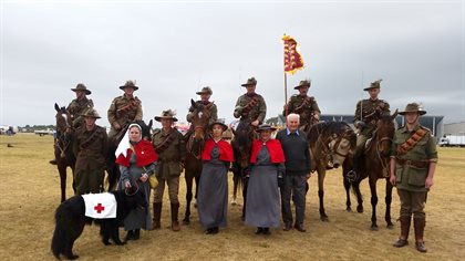 Ron Walters with members of the Troop in 22nd Lighthorse, 3rd Lighthorse and Australian Army Nursing Service uniforms with 22nd Lighthorse guidon © Ta
