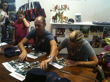 Signing magazines and hats at Equitana, 2011!