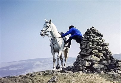 Some of us need all the help we can get to mount our horse! © Walter Baxter