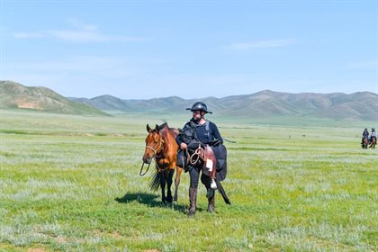 Tyler with an equine partner.